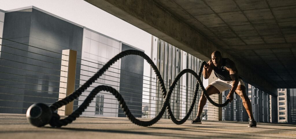 Athlete training with battle ropes